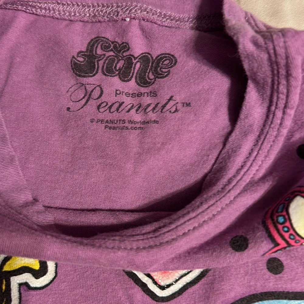 2 tee shirts and pair of shorts shirts are size girls medium. Puma and peanuts. - Picture 6 of 11